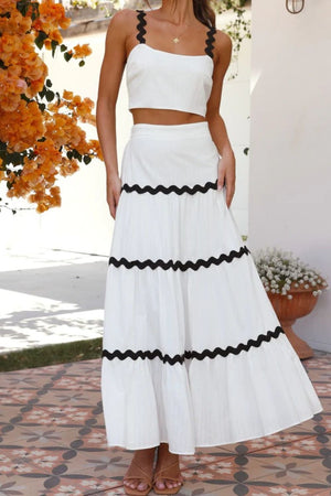 White crop top and tiered maxi skirt set with black scalloped trim detail.