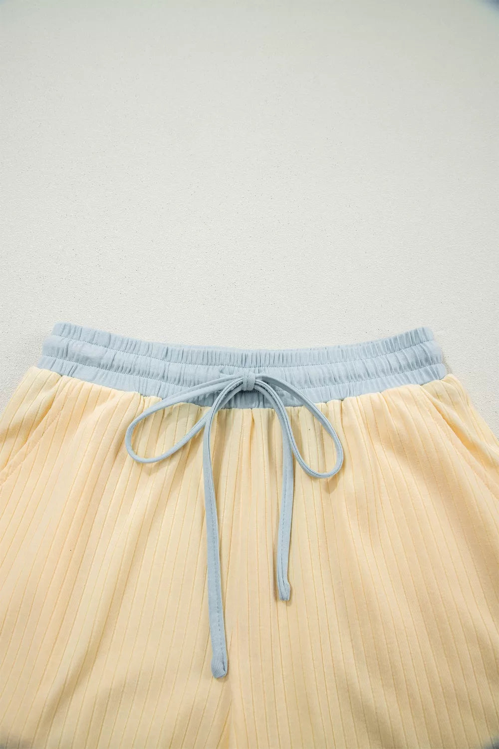 Color block cotton shorts with drawstring waist and ribbed texture.