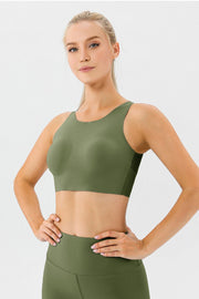 Green sculpted performance sports bra with scoop neck and racerback detail