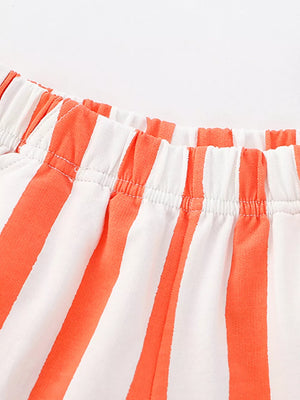 Baby shorts with orange and white vertical stripes and elastic waistband.