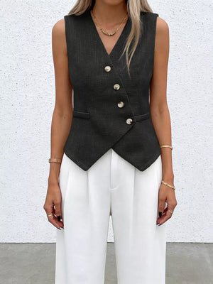 Black asymmetrical V-neck buttoned vest with textured fabric and pocket details.
