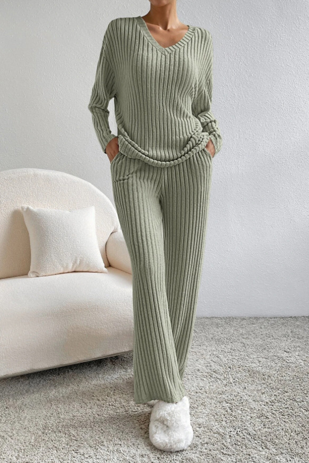 Sage ribbed knit loungewear set with v-neck sweater and wide-leg pants.