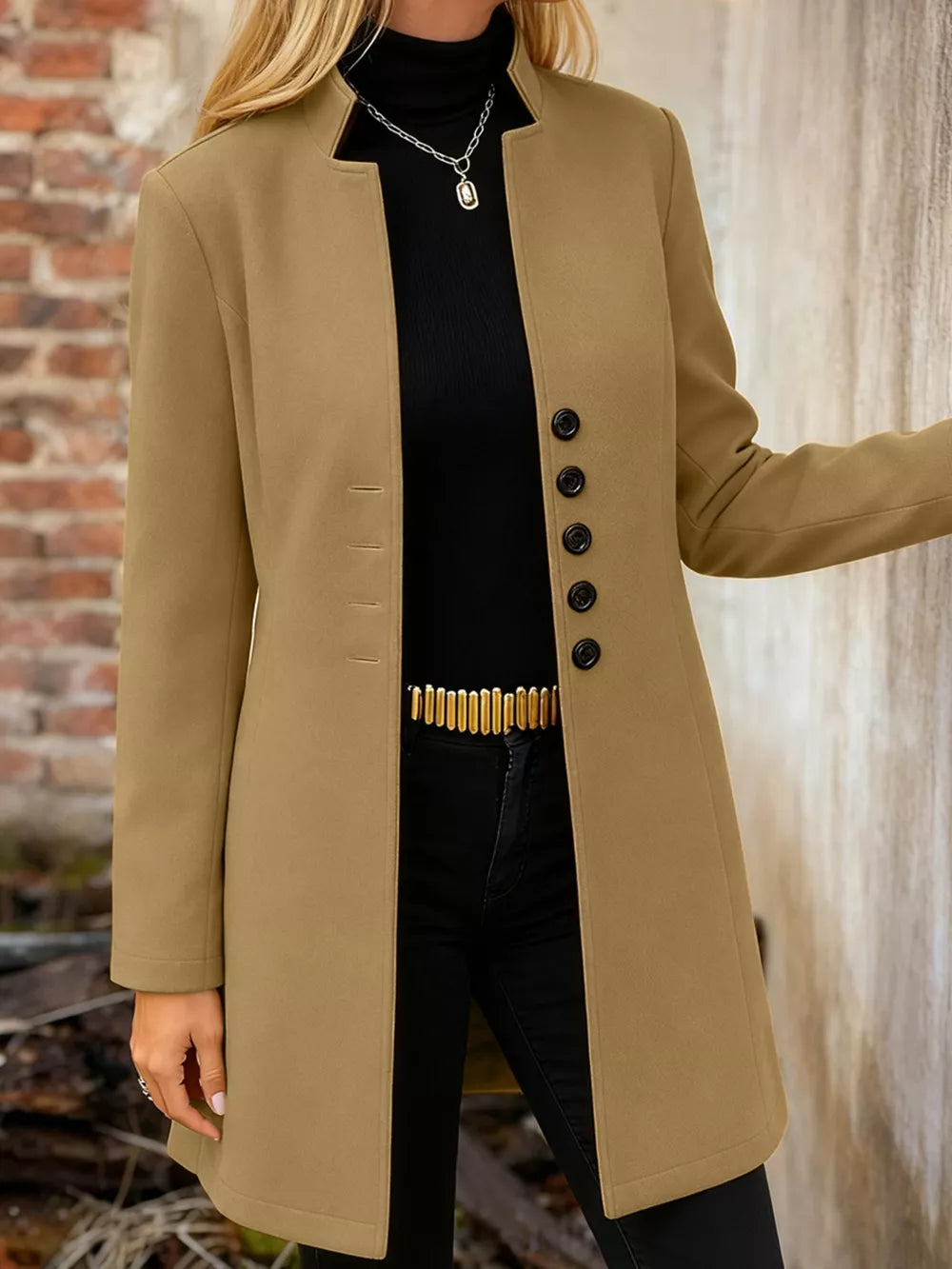 Khaki longline trench coat with button-down front and collarless neckline.