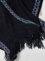Black knit hooded wrap with diamond pattern, embroidered trim, and fringe detail.