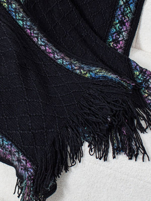 Black knit hooded wrap with diamond pattern, embroidered trim, and fringe detail.