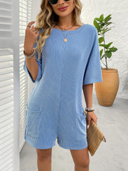 Sky blue ribbed knit romper with white pinstripes and front pockets.