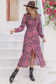 Bohemian ruffle collar maxi dress in purple with a floral print and high slit.