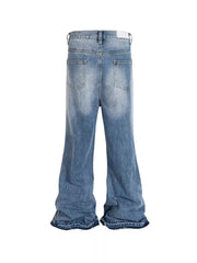 Distressed baggy fit men's jeans in light blue denim with wide legs and frayed hems.