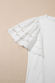 White cotton tee with ruffled lace inset short sleeves and eyelet detail.