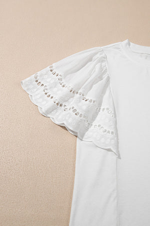 White cotton tee with ruffled lace inset short sleeves and eyelet detail.