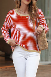 Nautical knit crewneck sweater with red and white stripes and contrast trim.