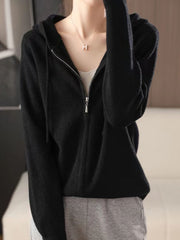 Black ribbed knit zip-through hoodie with drawstring hood and silver zipper detail.