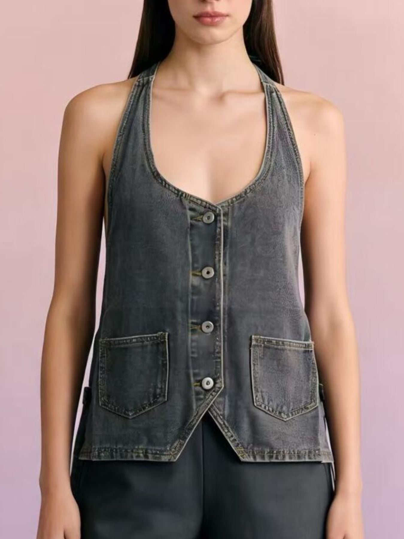 Button-down denim halter vest in dark gray with two front pockets and a V-neck.