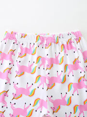 White girls' undershirt with pink unicorns and rainbow tails print.