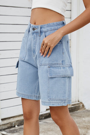 Medium wash denim cargo shorts with utility pockets and a relaxed fit.
