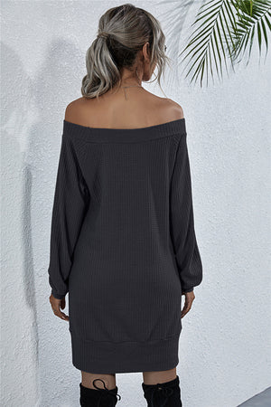 Off-shoulder waffle knit mini dress in dark gray with long sleeves and a relaxed fit.