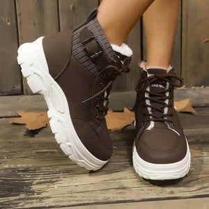 Chocolate lace-up boots with plush accents and knit ankle cuff detail.