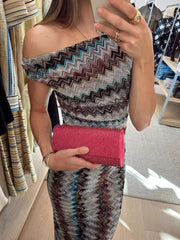 Vibrant one-shoulder maxi dress with chevron pattern and asymmetrical neckline.