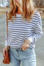 Nautical stripe crewneck sweatshirt in white with navy stripes, long sleeves, and crew neckline.