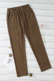 Corduroy drawstring trousers in mocha with slant pockets and a relaxed fit.