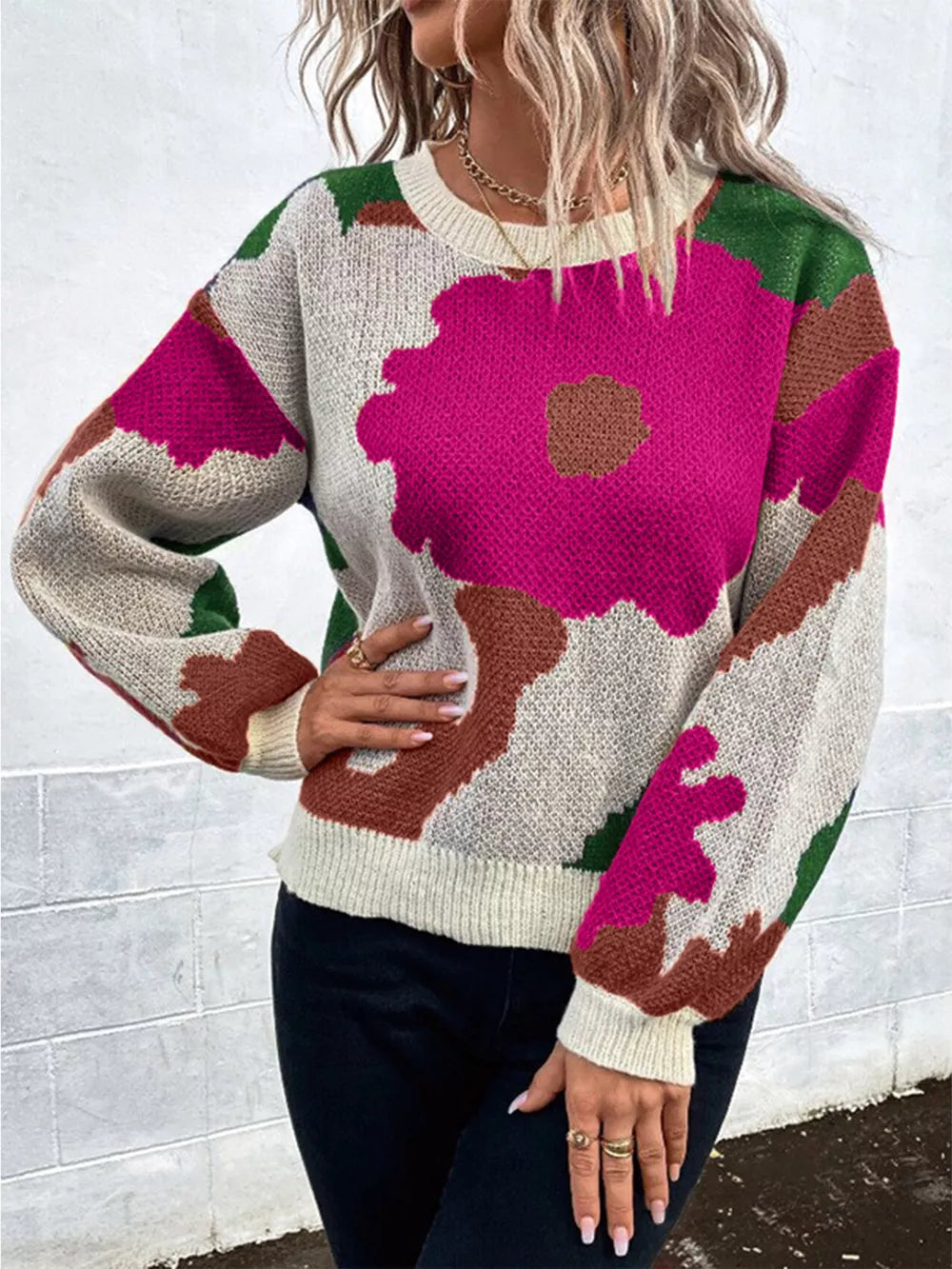 Abstract floral knit sweater with round neck in hot pink, green, and brown abstract pattern.