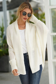 White cocoon knit sleeve cardigan with open front and ribbed cuffs.