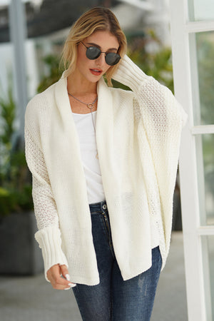 White cocoon knit sleeve cardigan with open front and ribbed cuffs.