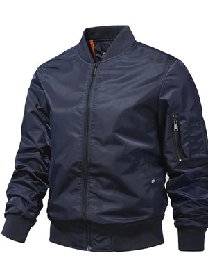 Men's blue zip-up bomber jacket with zippered sleeve pocket and ribbed cuffs