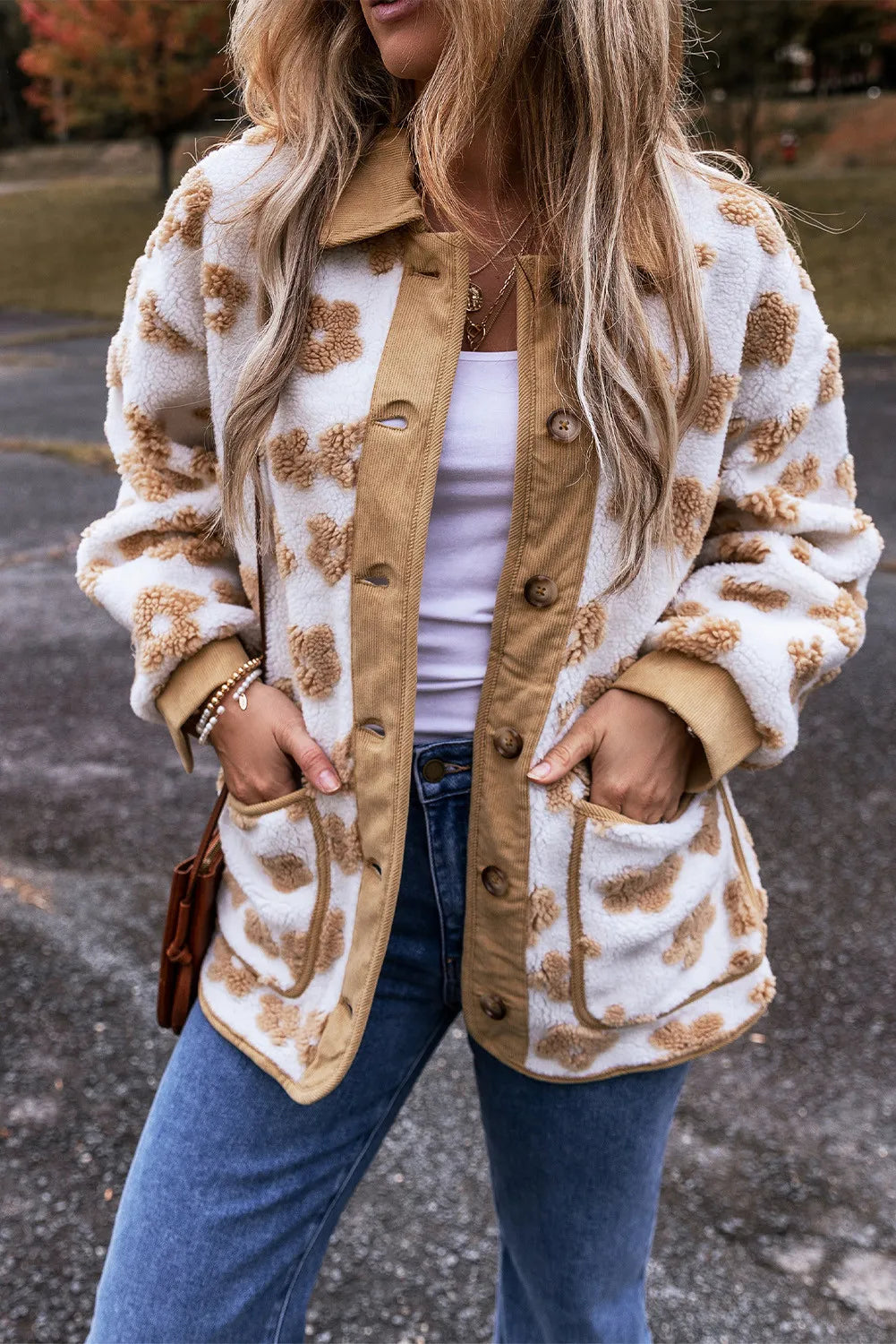 White floral sherpa jacket with corduroy trim and button front.