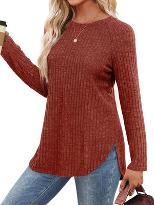Burgundy ribbed knit sweater with raglan sleeves and asymmetric hem detail.