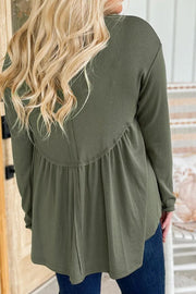 Moss ribbed peplum yoke blouse with long sleeves and a gathered hem.