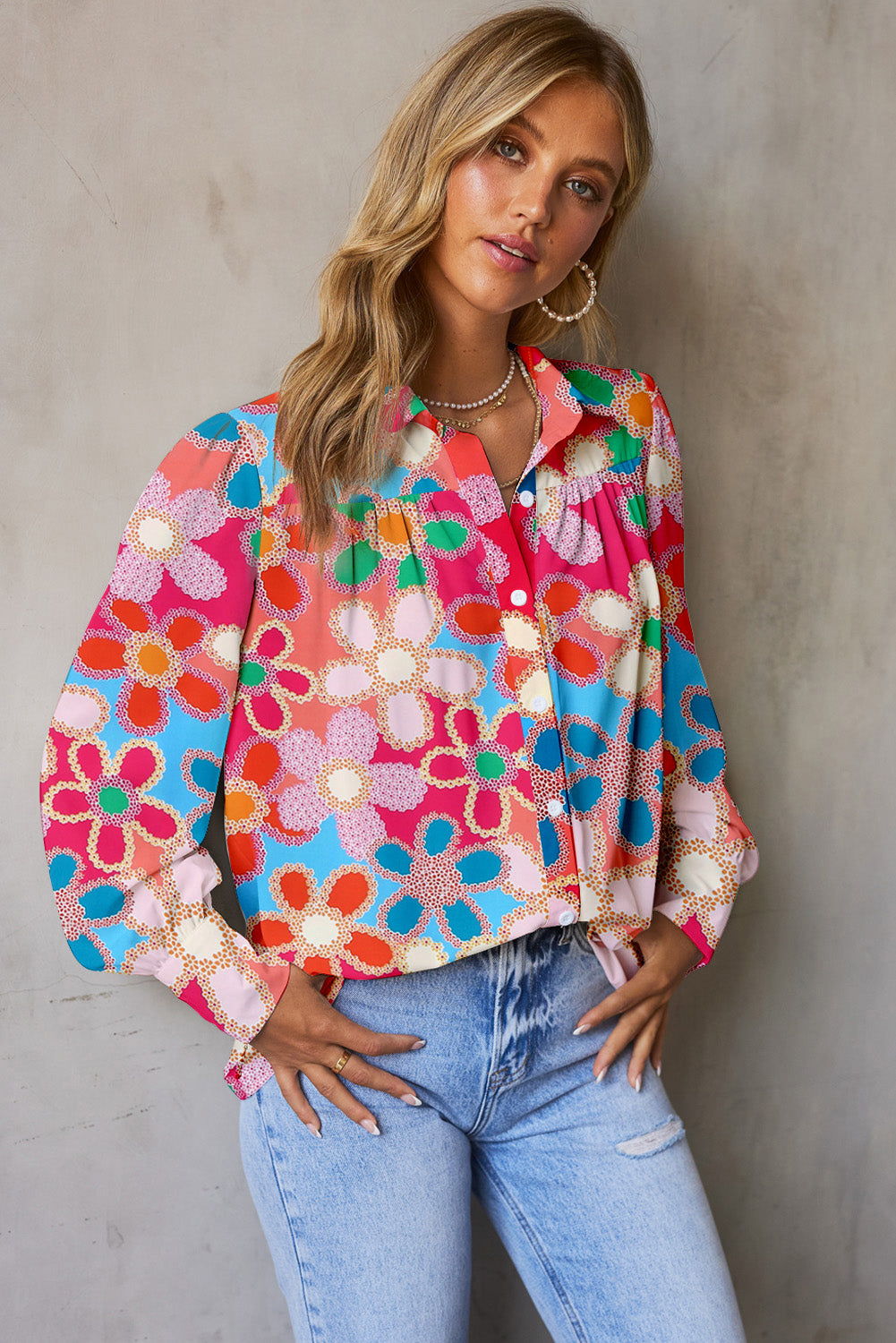 Multicolor floral print blouse with blouson sleeves and button front.