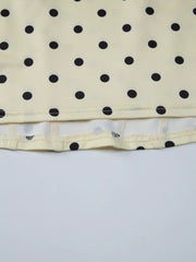 Pastel yellow polka dot tank top with sweetheart neckline detail