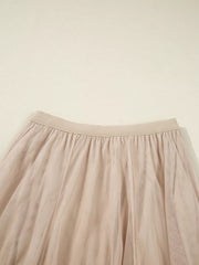 Lace overlay flared midi skirt in beige with elastic waistband and tulle fabric.