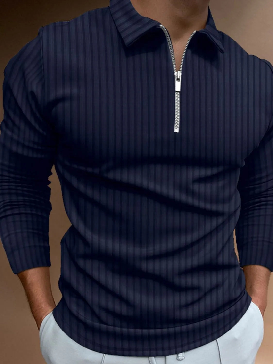 Navy textured zip-neck polo with vertical stripes and long sleeves.