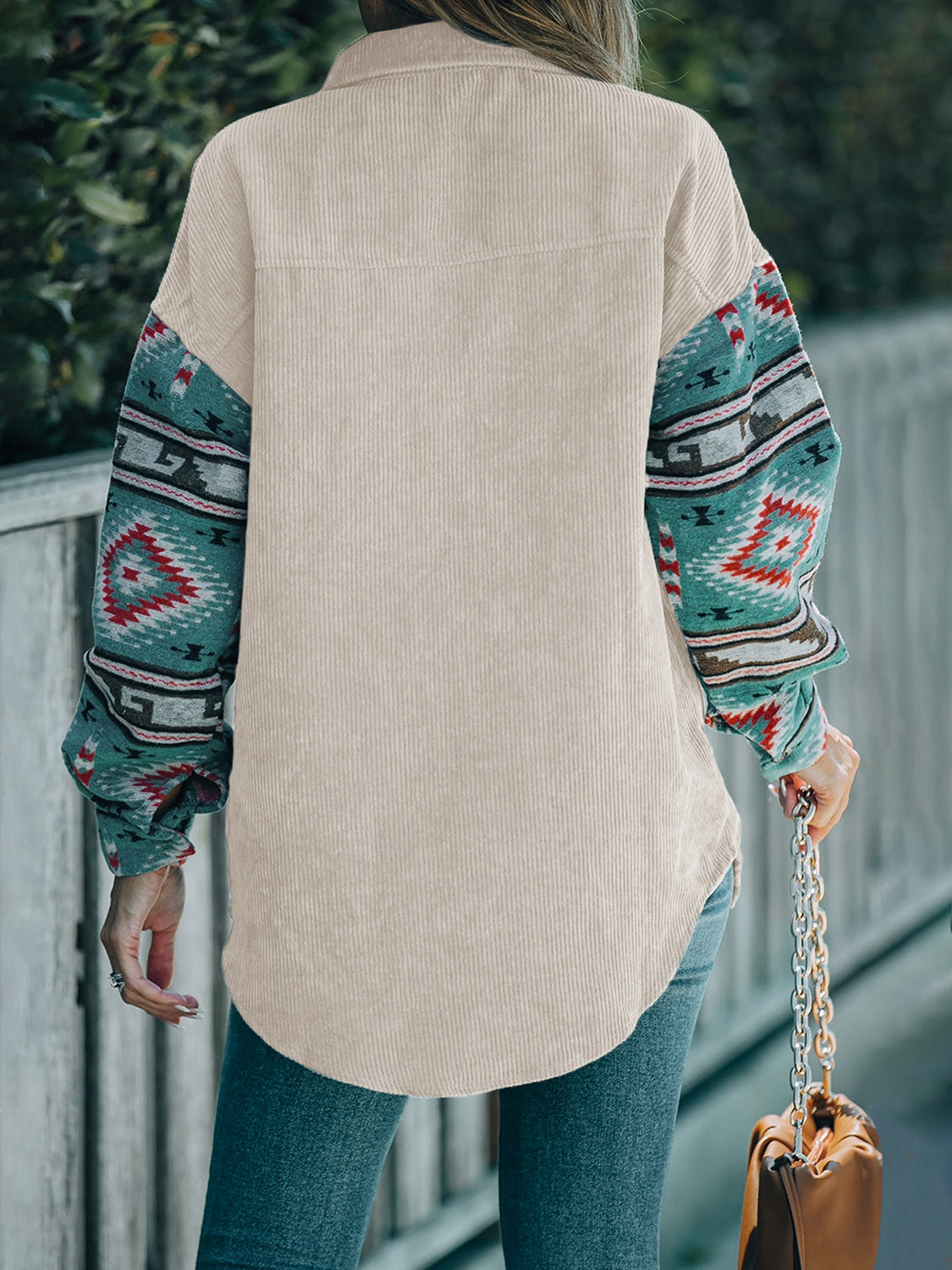 Corduroy shacket in Dust Storm with Aztec print sleeves and collar.