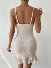 Beige waffle knit mini dress with ruffle hem and spaghetti straps.