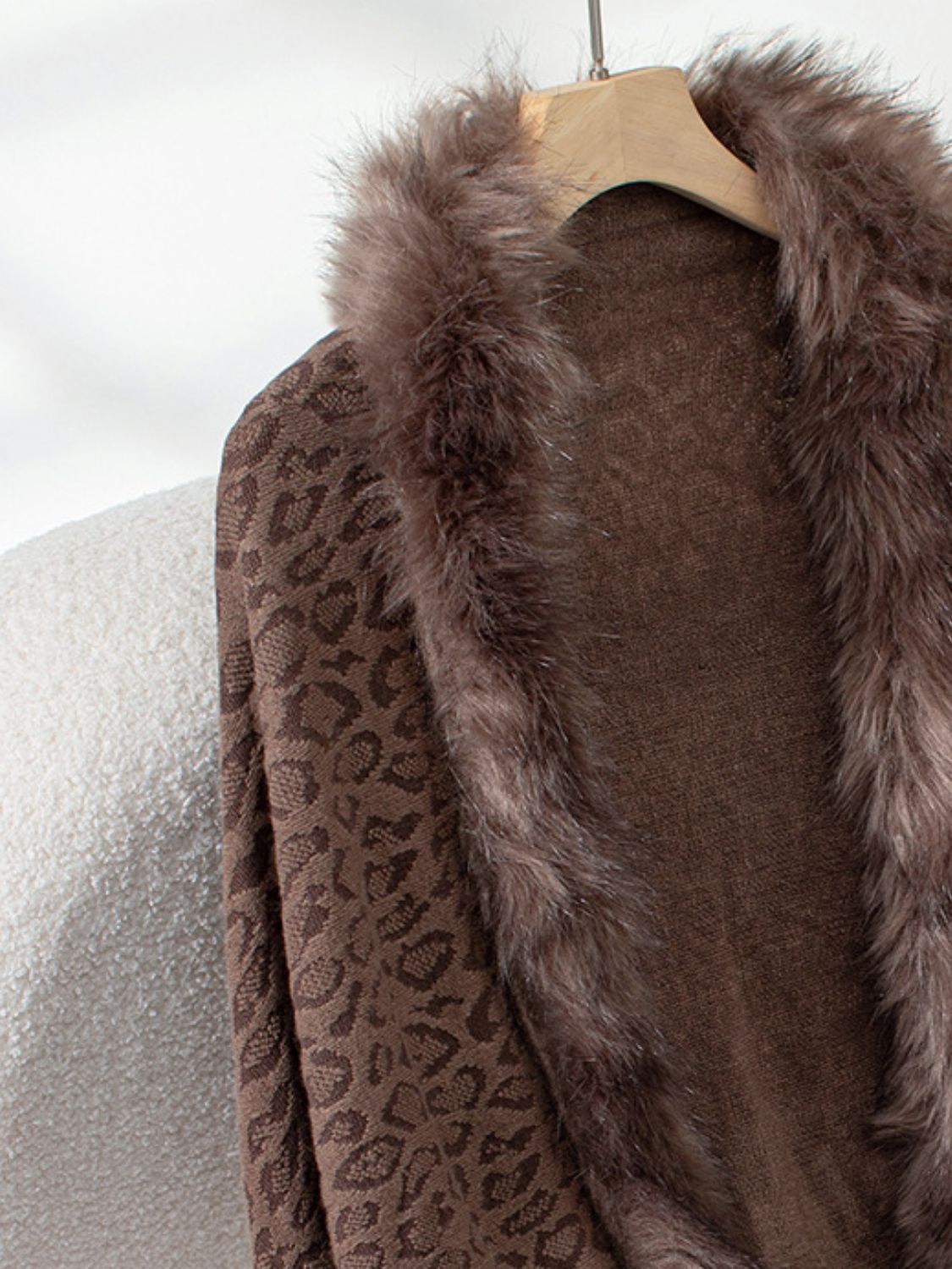 Brown leopard print acrylic cardigan with faux fur trim detail.