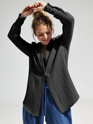 Black textured cotton overshirt with relaxed fit and button front.