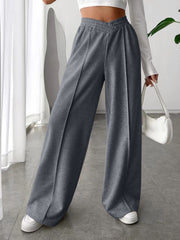 Dark gray V-waistline palazzo sweatpants with center seams and wide legs.