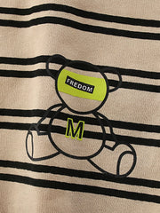 Tan striped cotton crew neck sweatshirt with a bear graphic and "FREEDOM" text detail.