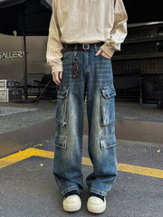 Men's vintage wash blue denim wide-leg cargo pants with multiple pockets.