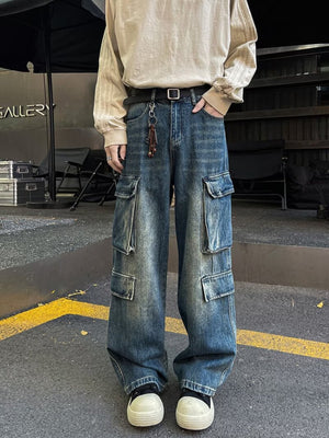 Men's vintage wash blue denim wide-leg cargo pants with multiple pockets.