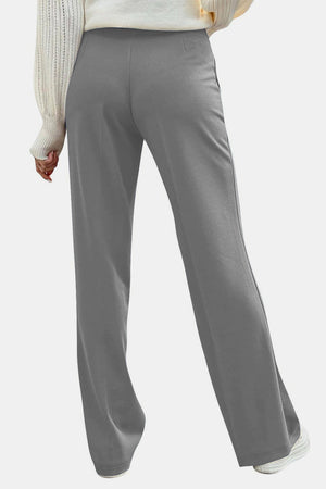 Gray wide leg trousers with button detail, shown from the back.