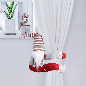 Charming gnome curtain tie-back in red and gray with striped hat, holding white curtains.