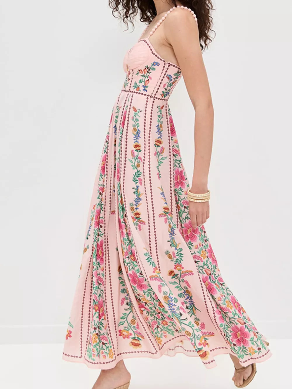 Pink floral sweetheart neckline maxi dress with beaded straps and striped pattern.