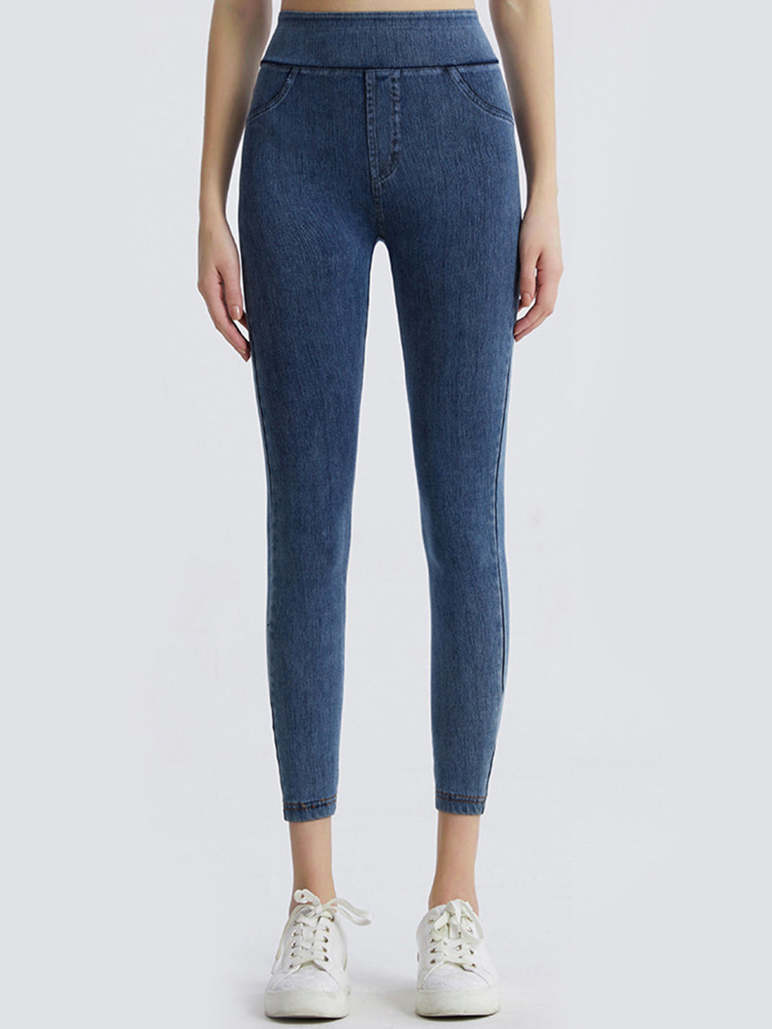Denim illusion leggings in medium wash with faux pocket details and a high waist.
