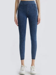 Denim illusion leggings in medium wash with faux pocket details and a high waist.