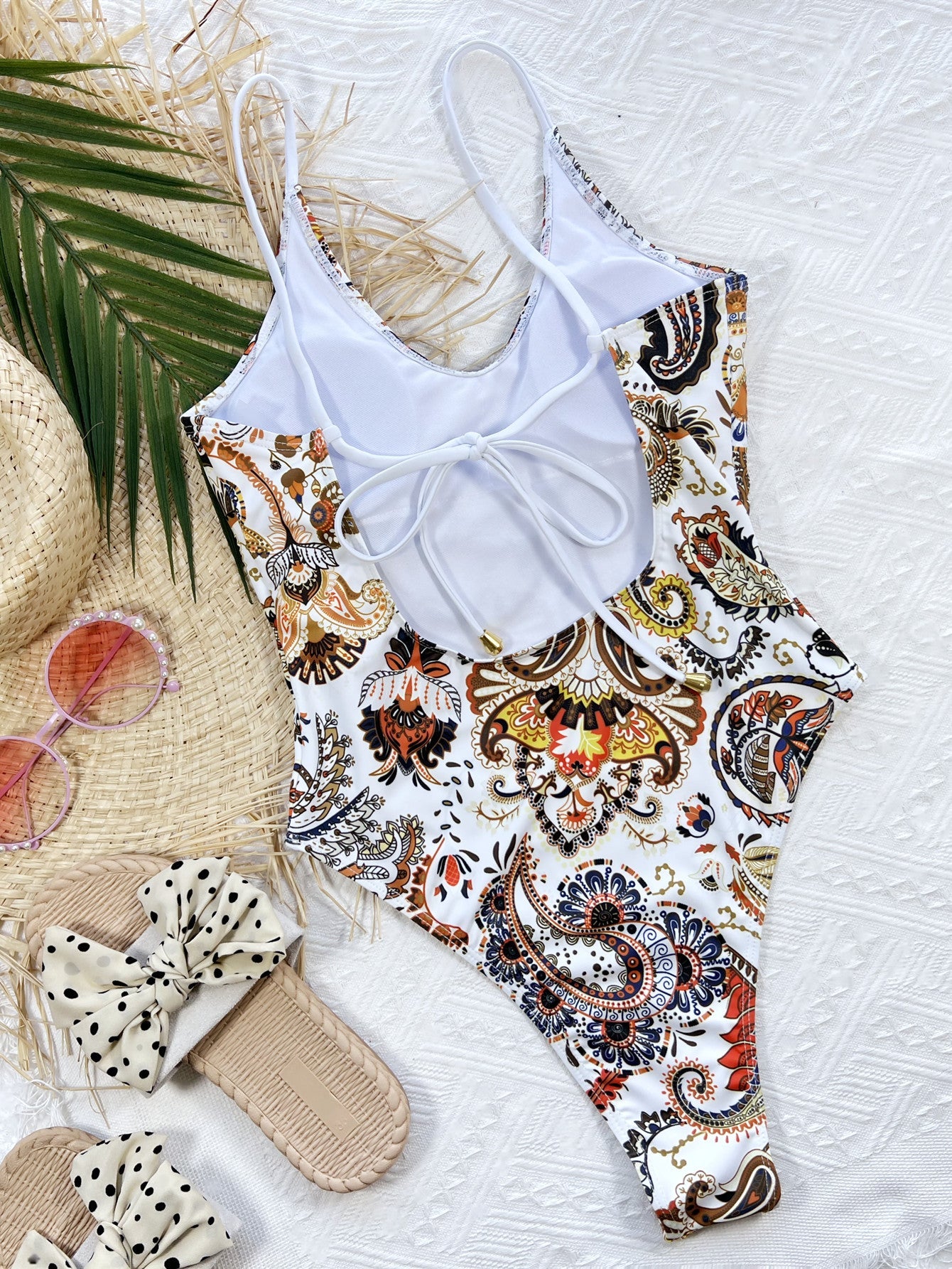 White paisley print one-piece swimsuit with tie-back detail