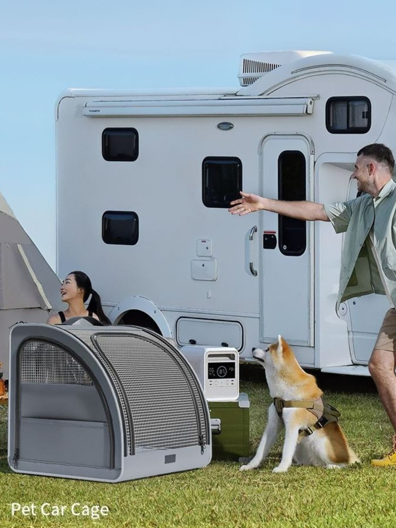 Gray travel-friendly pet carrier with mesh ventilation and zippered pockets, shown outdoors.
